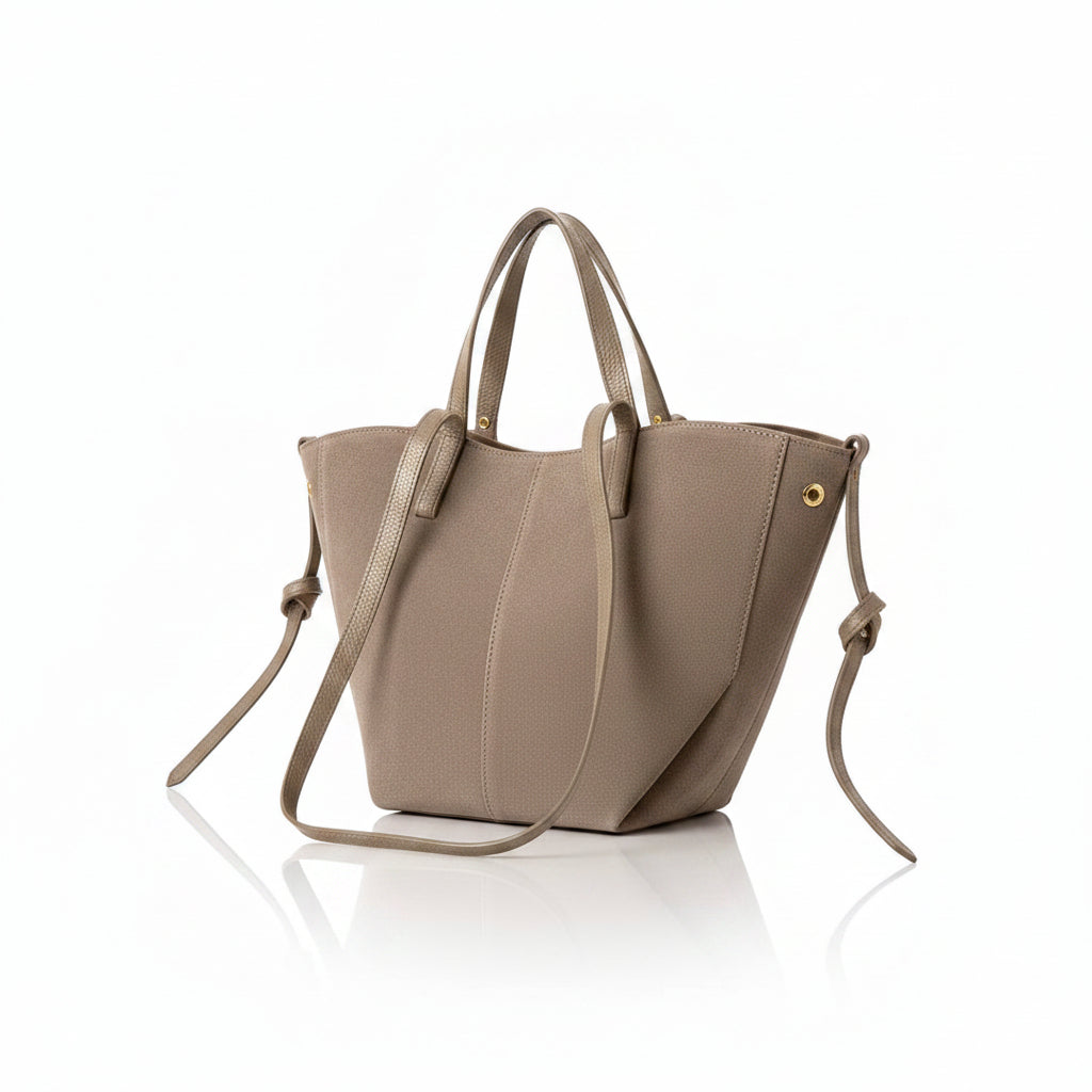 Dark taupe suede tote bag with shoulder strap on a white background