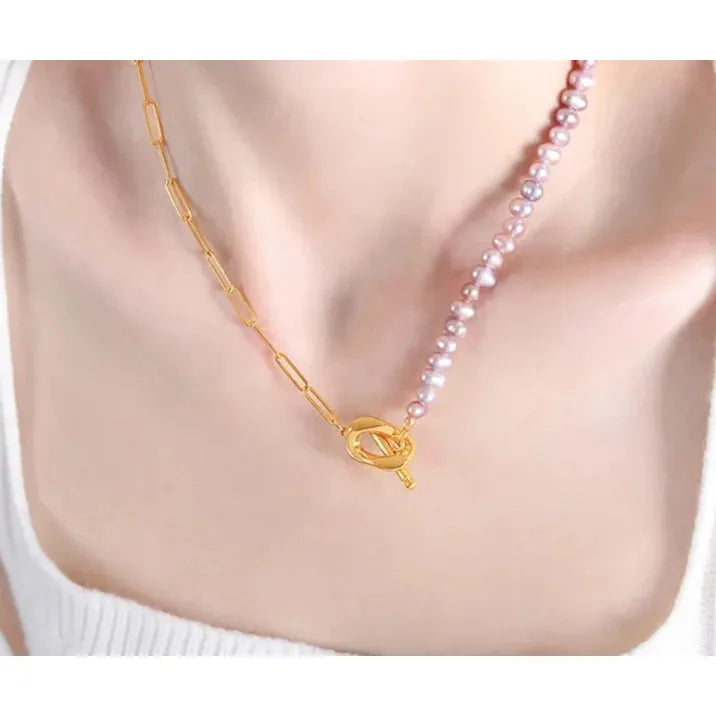 Paperclip and Pearl T Bar necklace in Gold with simulated freshwater pearls in a soft pink colour.