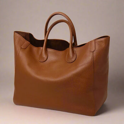 Large Top Handle Leather Tote Bag with a flat, structured base and one main compartment. Tan. 