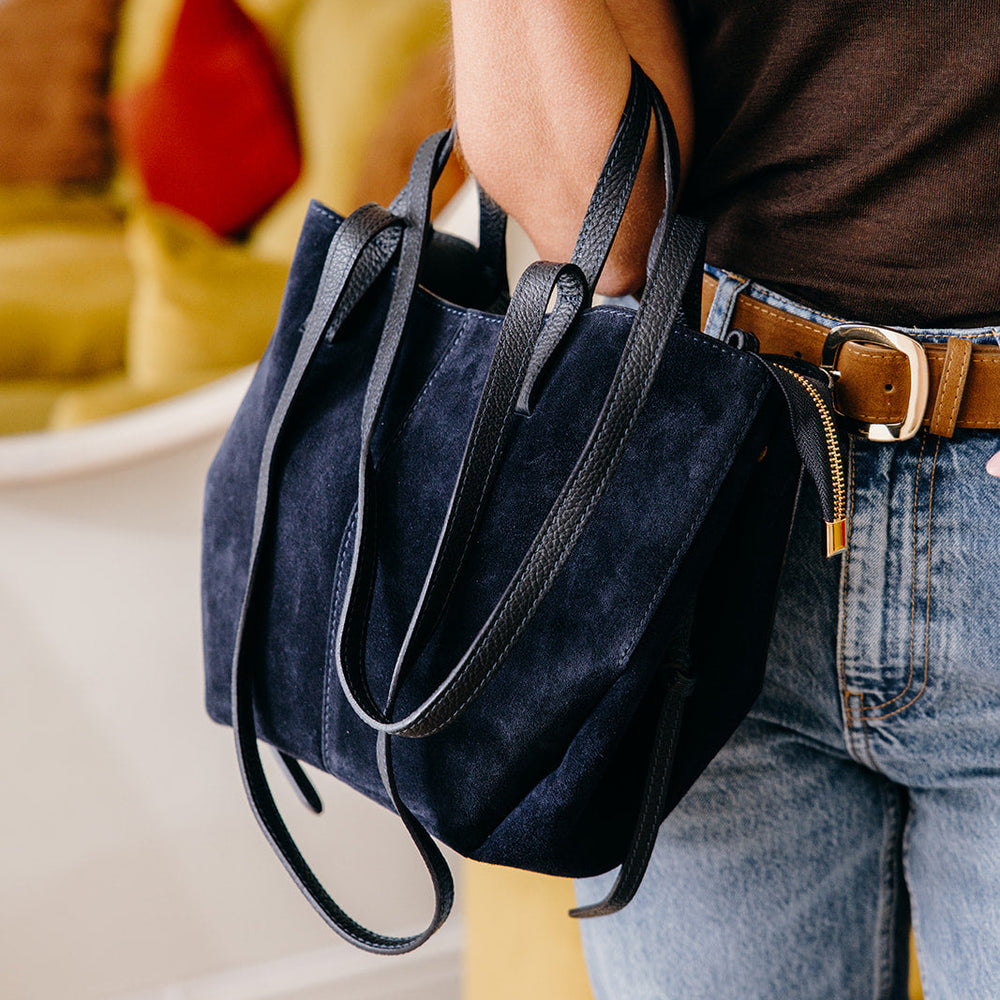 Navy Suede Tote Bag handheld by model