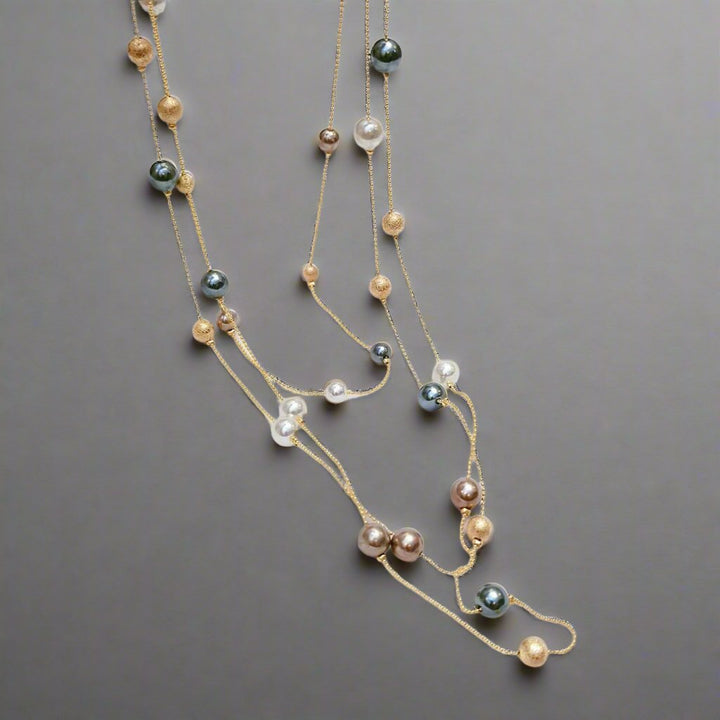 The Shelby is a statement multi strand station necklace featuring simulated pearls throughout, on a delicate zinc alloy gold wire. 45cm longest length. White pearl or gray (coloured). 