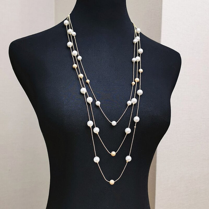 The Shelby is a statement multi strand station necklace featuring simulated pearls throughout, on a delicate zinc alloy gold wire. 45cm longest length. White pearl or gray (coloured). 