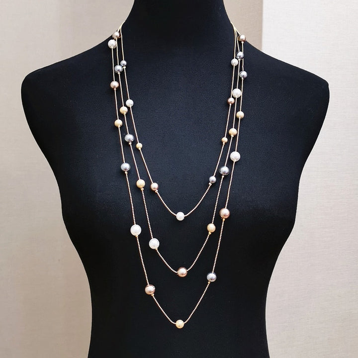 The Shelby is a statement multi strand station necklace featuring simulated pearls throughout, on a delicate zinc alloy gold wire. 45cm longest length. White pearl or gray (coloured). 