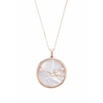 White mother of pearl and cubic zirconia make the perfect backdrop to this rose gold taurus zodiac necklace. The reverse of this pendant is equally as beautiful, featuring cut-out stars gently peeping through and the engraved name of your sign. Gift boxed.