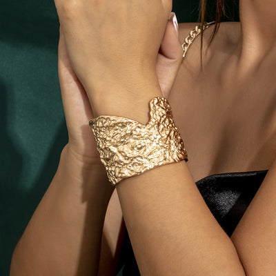 The stunning Molten Lava statement cuff is crafted from zinc alloy and features a textured design with irregular edge detail.  Gently adjustable. Gold or Silver.