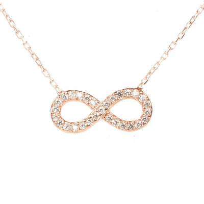 The Eternity Infinity Necklace is handcrafted in sterling silver and dipped in 22ct gold, rose gold or rhodium each necklace is adorned with AAA grade  multifaceted white zircons.  Finished with a lobster clasp, and size adjuster.  Gift boxed.