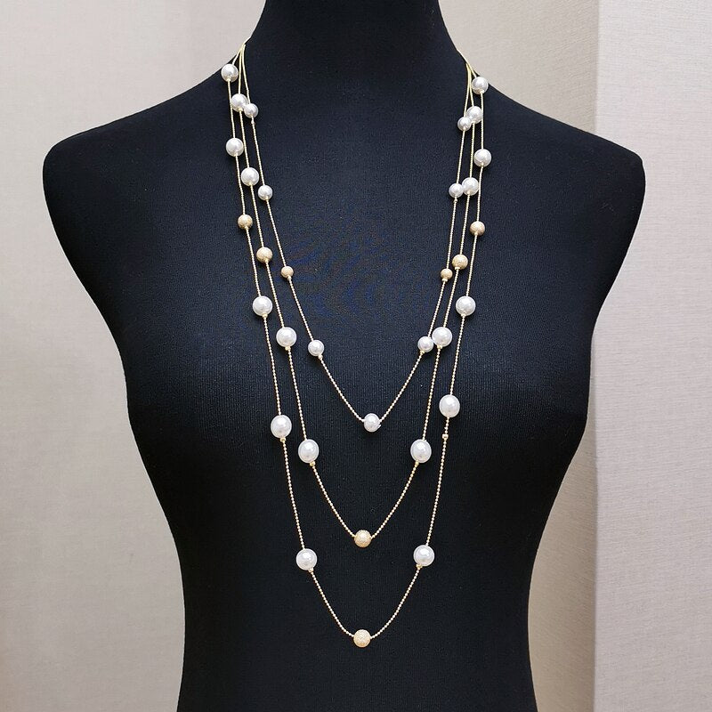 The Shelby is a statement multi strand station necklace featuring simulated pearls throughout, on a delicate zinc alloy gold wire. 45cm longest length. White pearl or gray (coloured). 