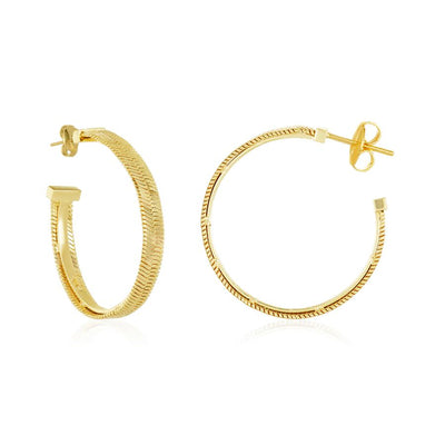 From LA based celebrity jewellery designer Melinda Maria, the 1" Demi Herringbone Hoops are sure to make you feel strong and sexy. These feather light hoops are faceted with a distinctive herringbone pattern to shimmer and glow around the face.