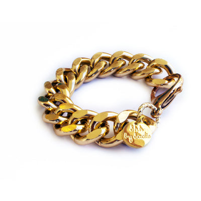 Amira is a traditionally styled chunky gold chain bracelet with flat edges and disc fob. Ships from our UK warehouse.