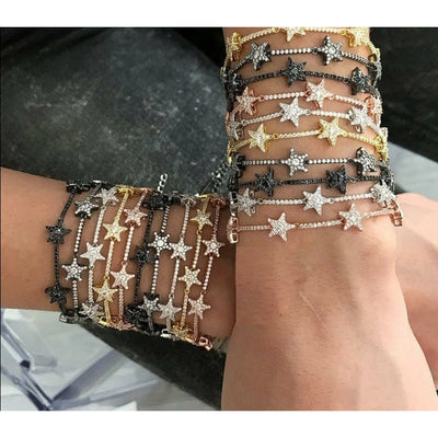 RiRi is a stunning pave chain link bracelet with beautiful pave studded stars stationed across the style.  Copper alloy base plated in gold or platinum.  Extendable. Length 16cm + 5cm.
